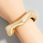 GOLD WAVY METAL BANGLE